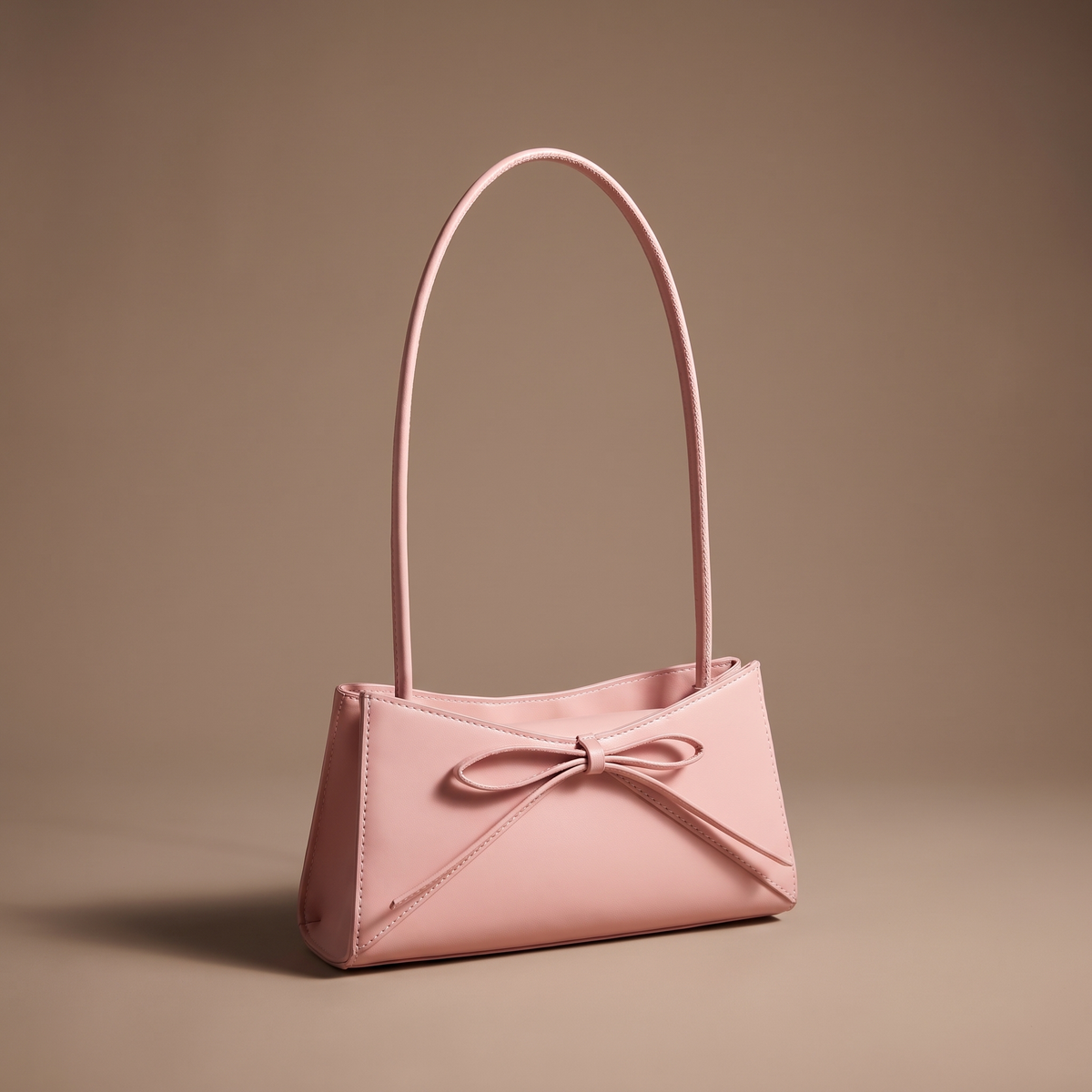 Women's pink structured shoulder bag with bow detail