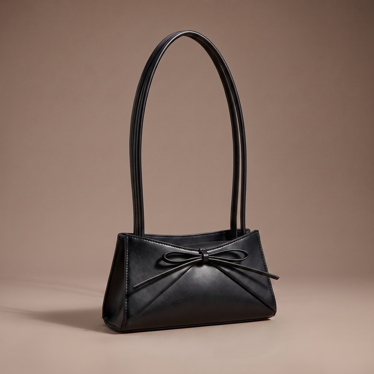 Women's black structured shoulder bag with bow detail