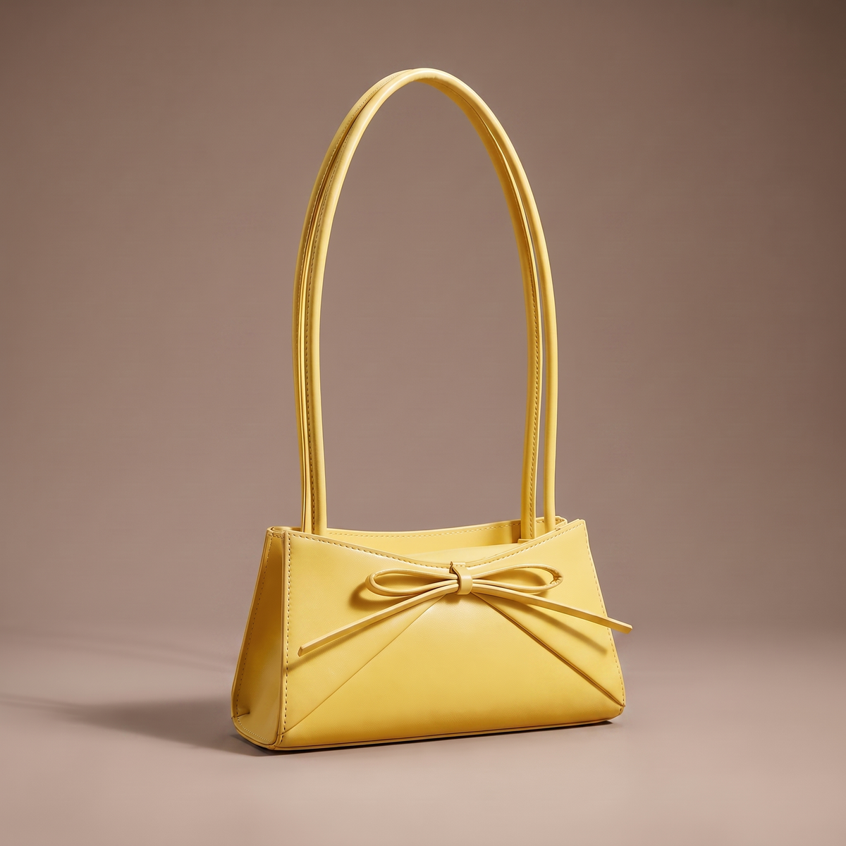 Women's yellow structured shoulder bag with bow detail
