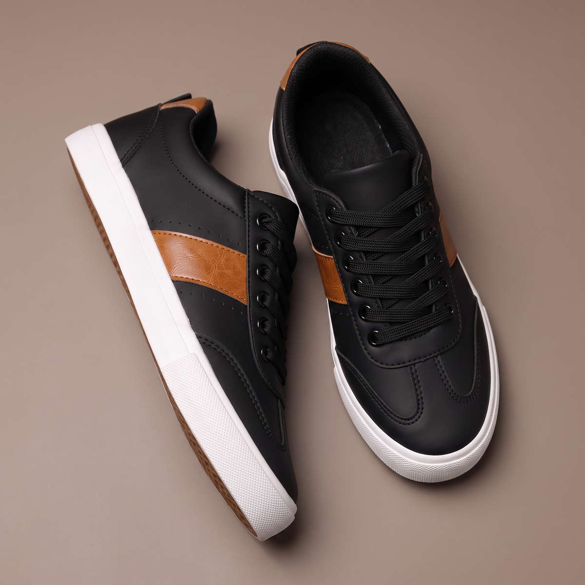 Men's black casual low-top sneakers with brown side detail - top view
